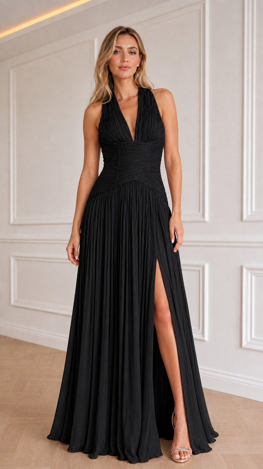 Model wearing black color variant of the halter pleated evening dress