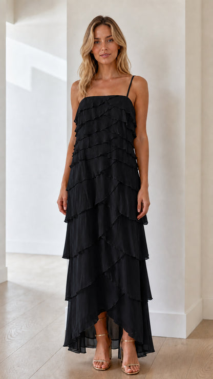Model wearing black tiered ruffle maxi dress