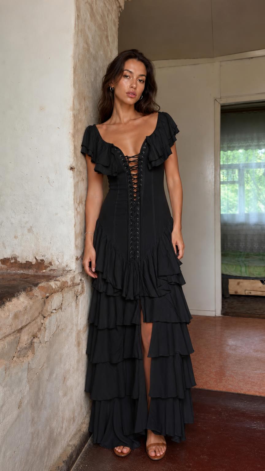 Front view of model wearing black bohemian ruffle lace-up maxi dress