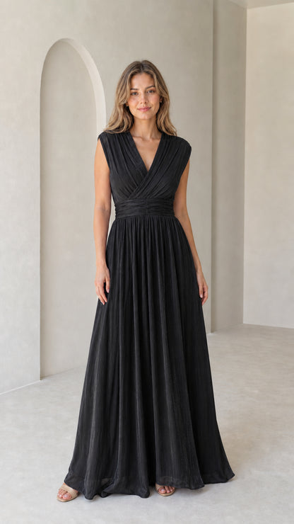 Model wearing black pleated V-neck formal sleeveless maxi dress