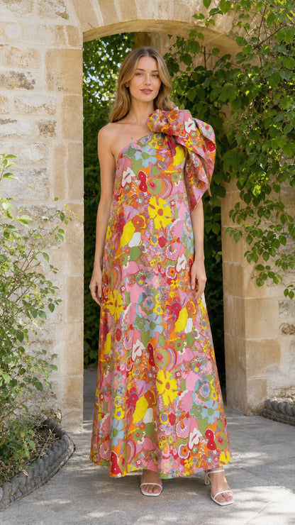 Model wearing pink multi floral one-shoulder maxi dress