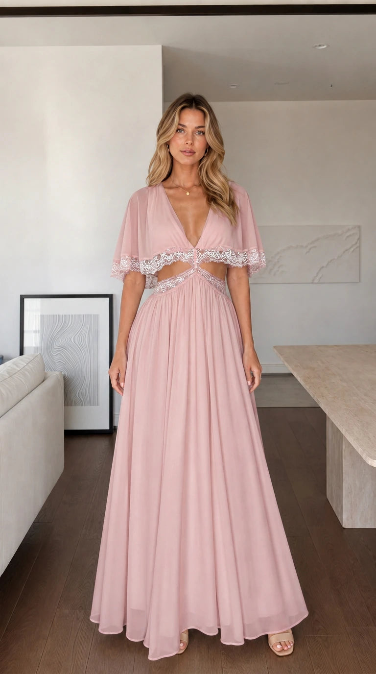 Front view of woman wearing pink maxi dress with lace cut-outs