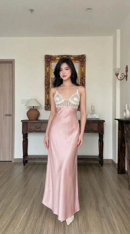 Woman wearing pink satin maxi slip dress with crochet contrast