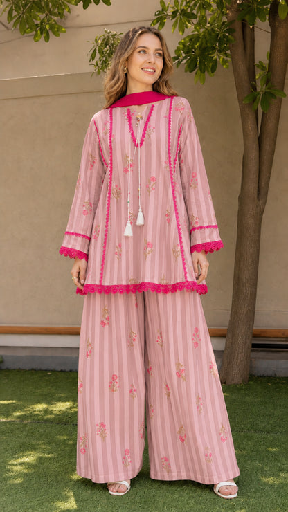 Woman wearing pink variant of striped floral kurti and palazzo set