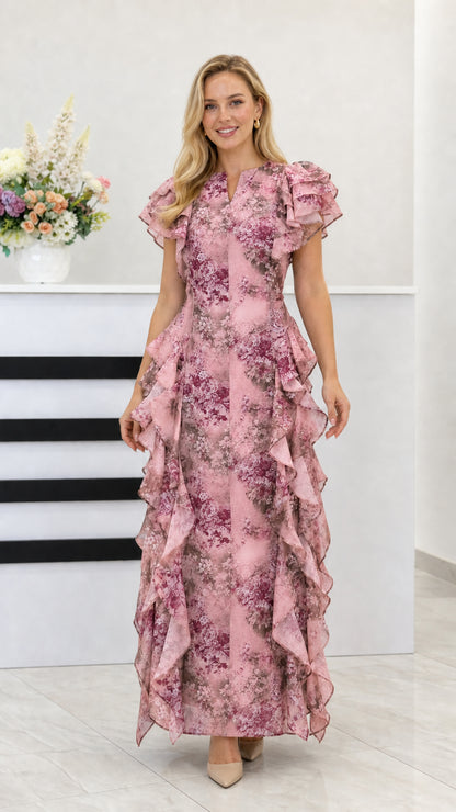Blush pink floral ruffle maxi dress with flutter sleeves shown from the front