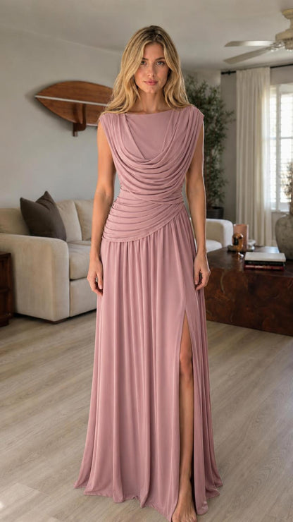 Model wearing dusty pink cowl neck maxi dress with high slit