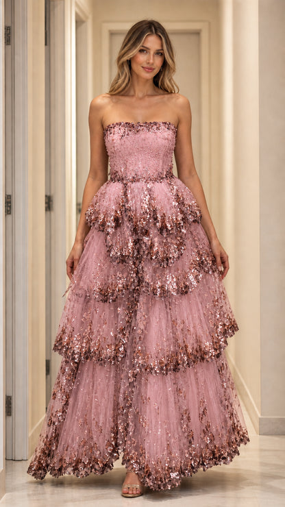 Model wearing pink strapless tiered sequin gown