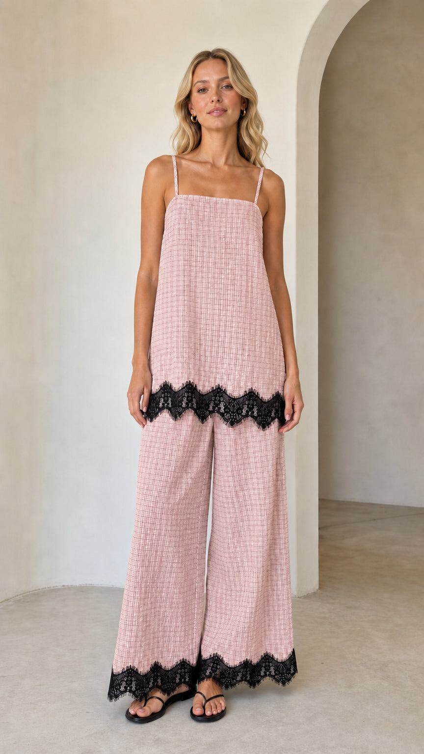 Model wearing pink plaid two-piece set with black lace hem