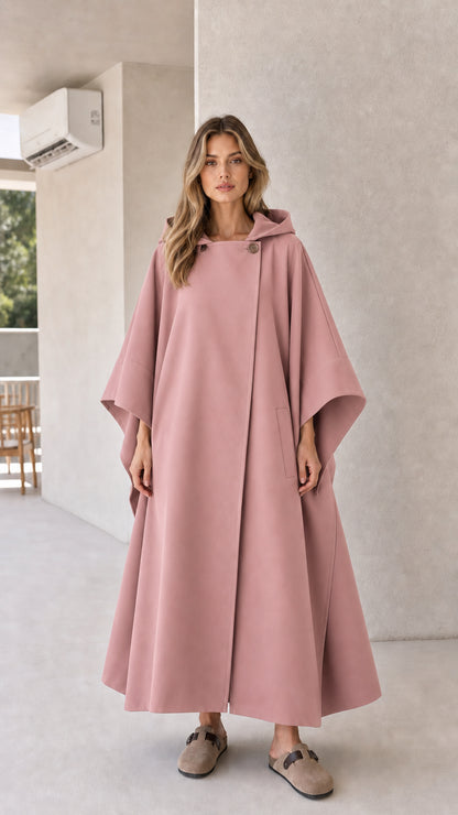 Model wearing dusty pink hooded long cape coat