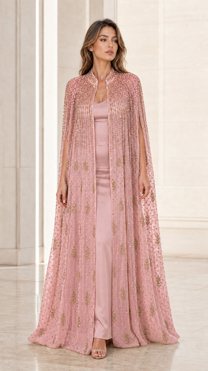Model wearing dusty pink floor-length beaded cape evening gown