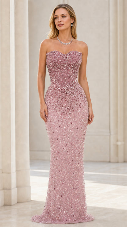 Front view of model wearing pink beaded strapless mermaid evening gown