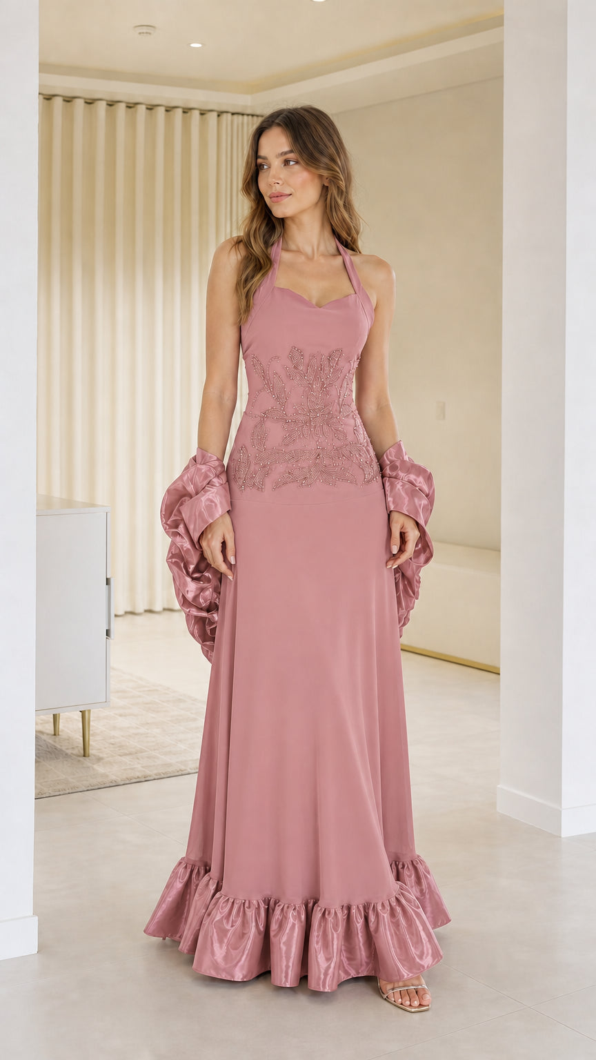 Front view of woman wearing pink halter neck evening dress