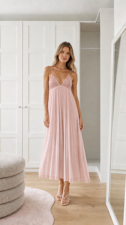 Front view of model wearing pink sequin pleated maxi dress
