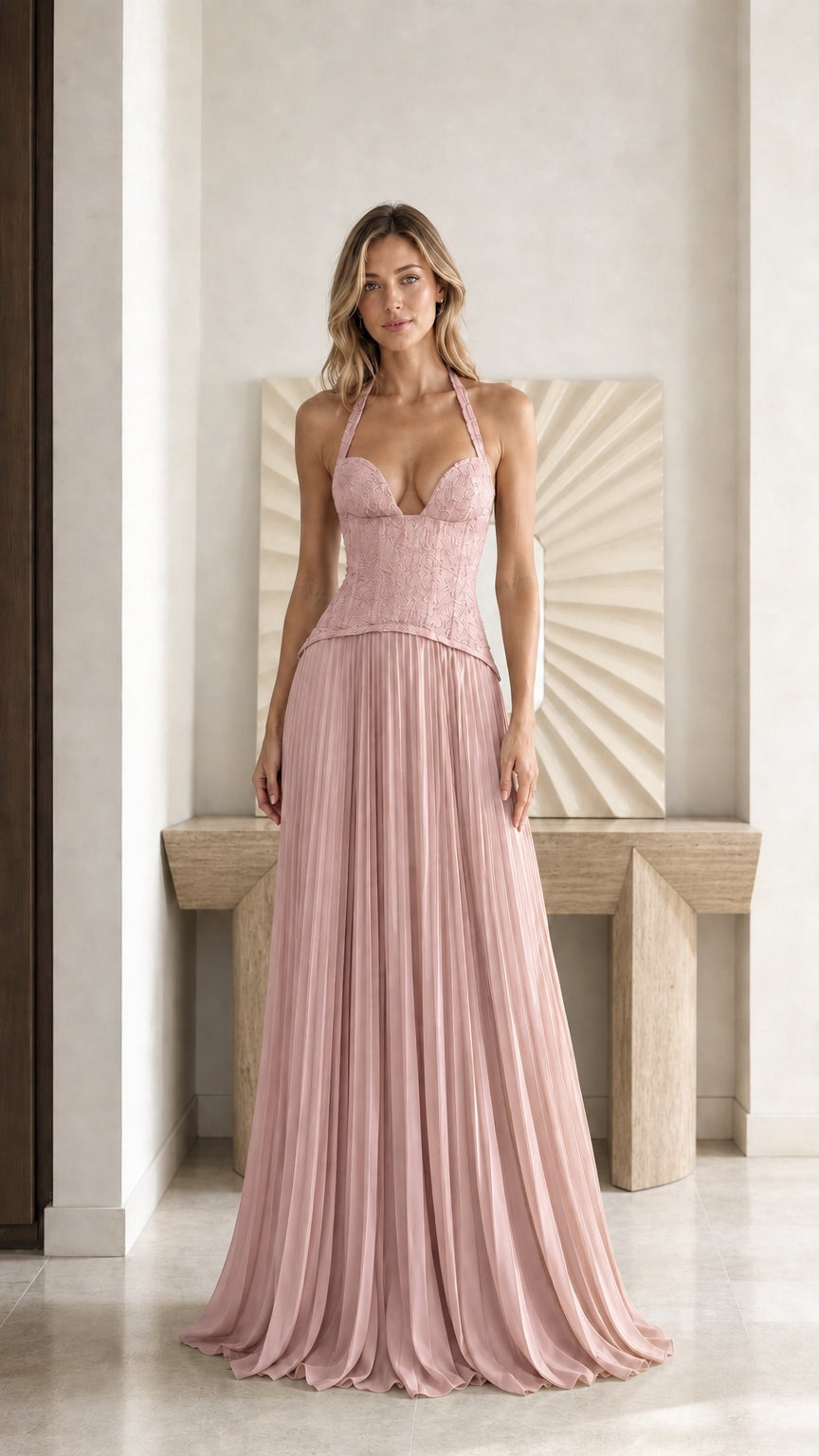Front view of model wearing blush pink halter lace corset pleated maxi dress