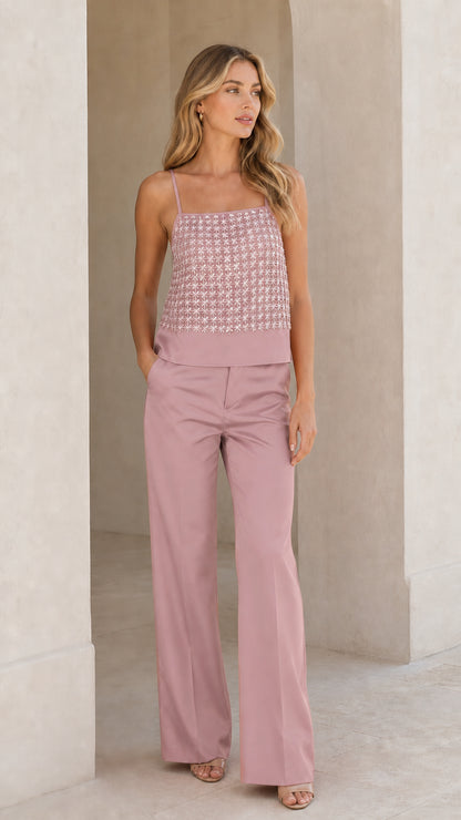Woman wearing mauve sequined cami and wide-leg pant set