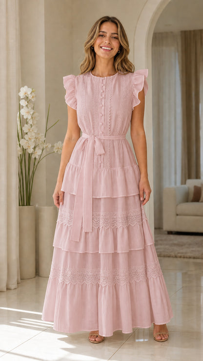 Woman wearing pink ruffle sleeve tiered maxi dress
