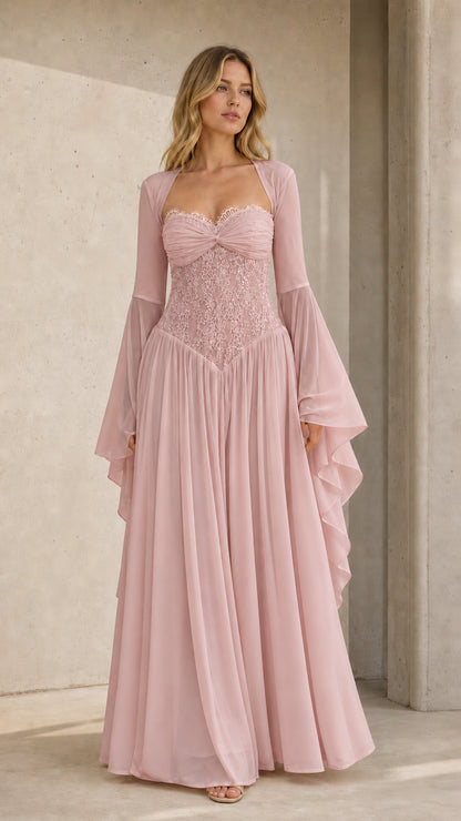 Front view of model wearing dusty pink lace corset evening gown with flared sleeves