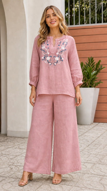 Woman wearing pink embroidered top and wide leg pants set