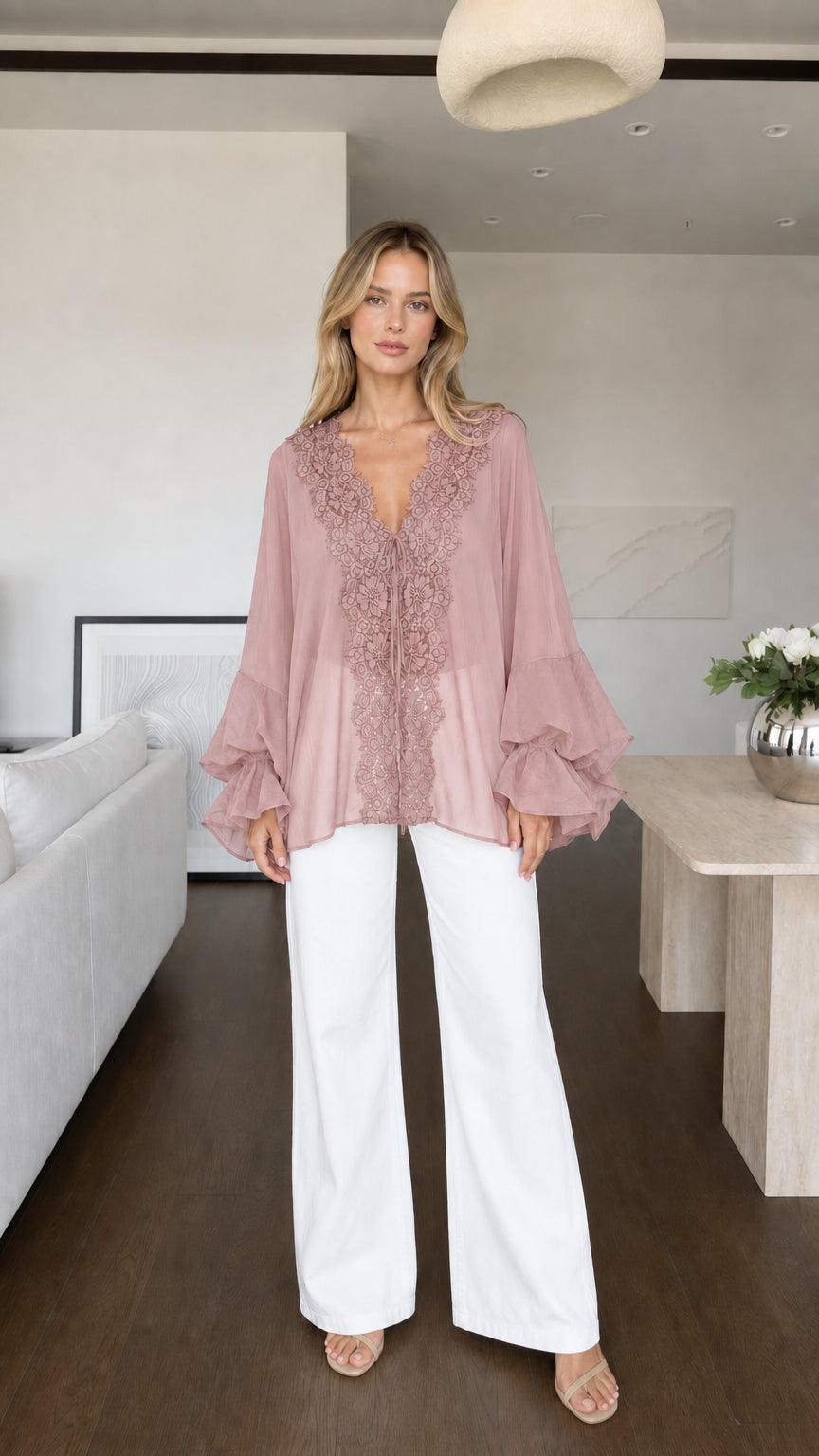 Model wearing pink boho lace trim blouse front view