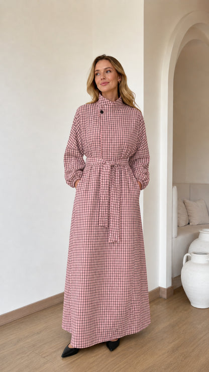 Front view of woman wearing Dusty Pink check long sleeve belted maxi dress