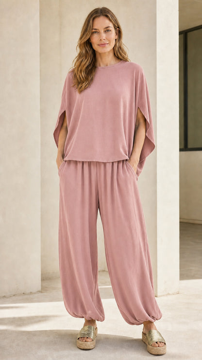 Woman wearing dusty pink matching two-piece lounge set