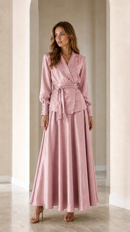 Front full view of woman wearing Dusty Pink satin wrap blazer and maxi skirt two-piece set