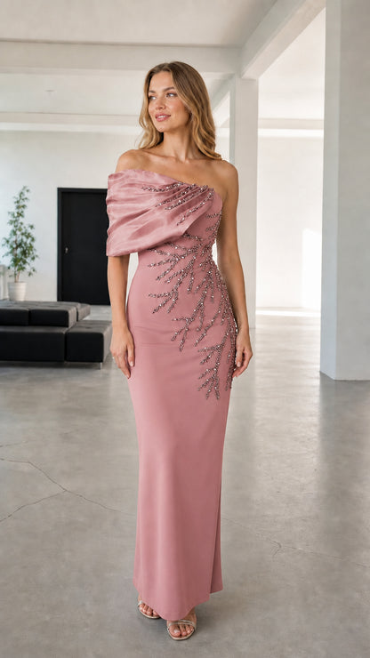 Full-length view of dusty rose asymmetric draped beaded evening maxi gown