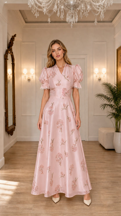 Model wearing pink floral embroidered maxi dress