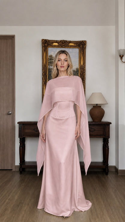 Front view of woman wearing pink cape overlay evening dress