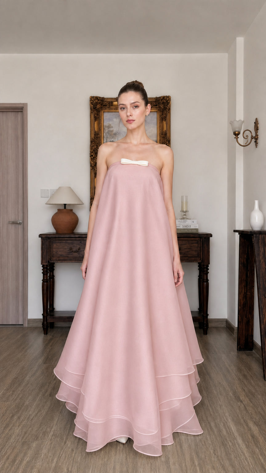 Woman wearing pink strapless tiered long dress