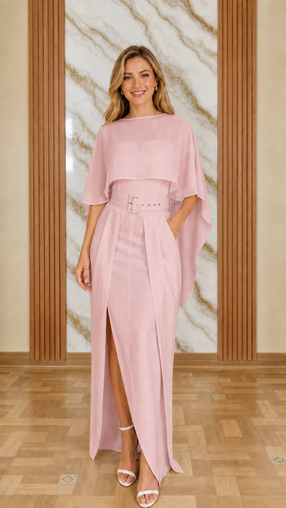 Model wearing pink cape overlay jumpsuit