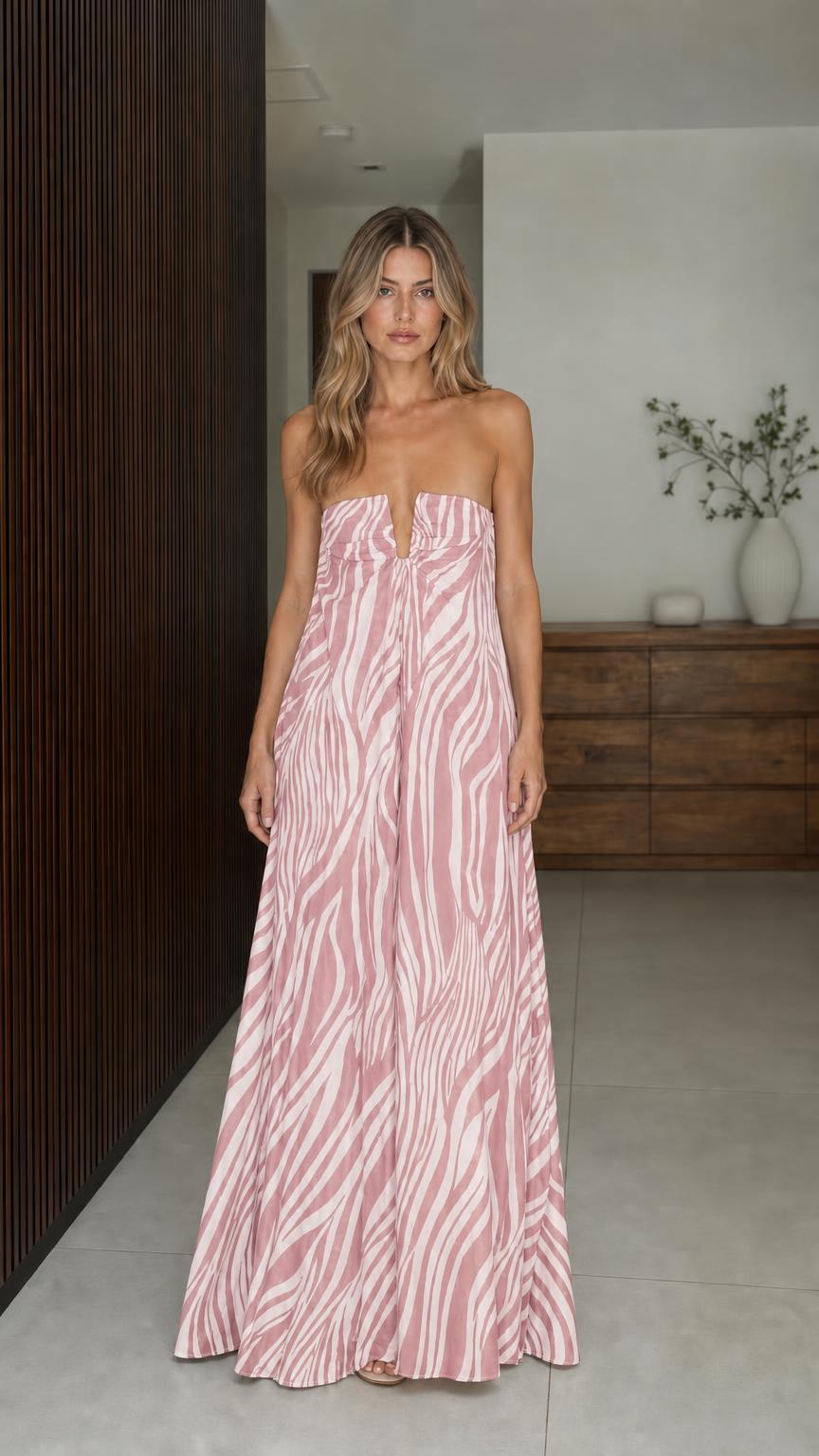 Model wearing pink zebra print strapless maxi dress