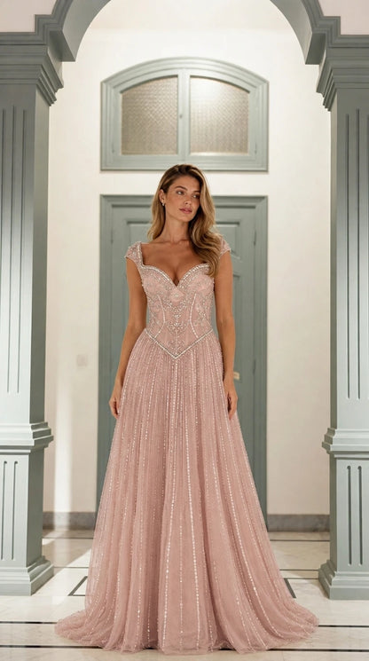 Front view of blush pink beaded formal gown
