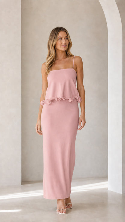 Model wearing pink sleeveless ruffle trim maxi camisole dress