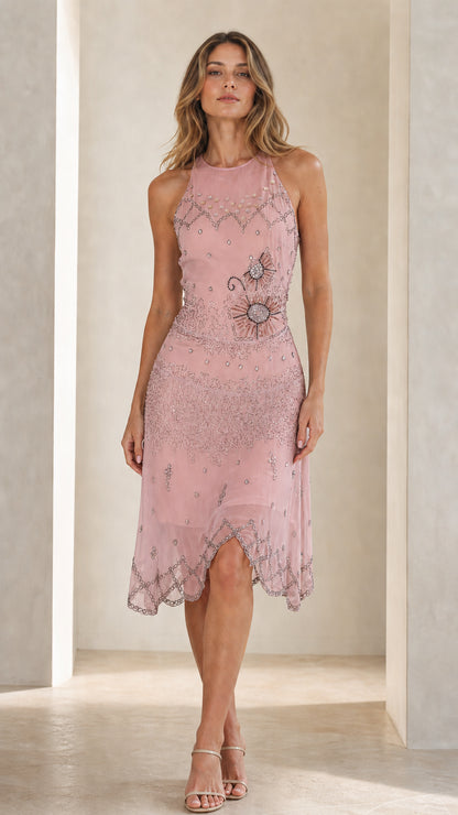 Front view of model in blush pink embellished halter midi dress