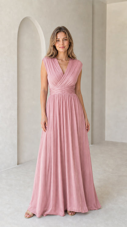 Model wearing dusty rose pleated sleeveless empire waist evening gown