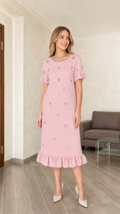 Model wearing pink embellished midi dress