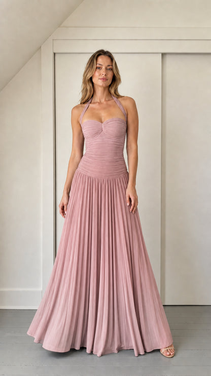 Model wearing dusty rose ruched halter maxi dress