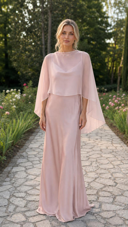 Model wearing blush pink capelet evening dress