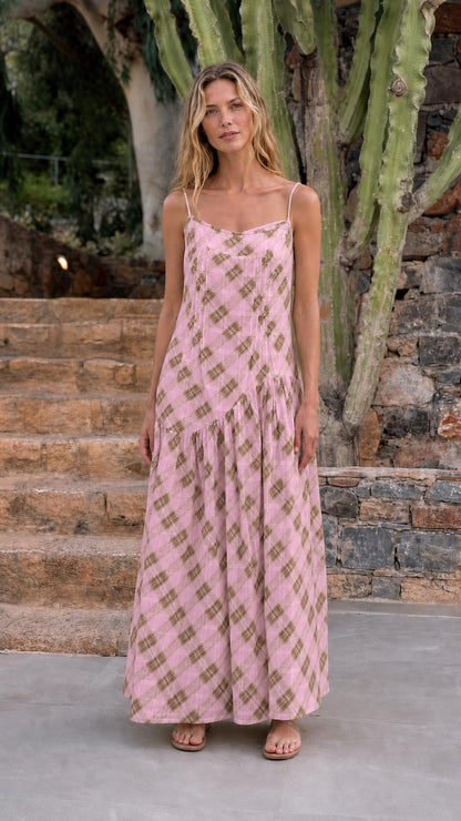 Front view of woman wearing pink plaid maxi dress