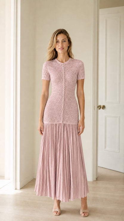 Front view of pink pearl button knit bodice pleated midi dress