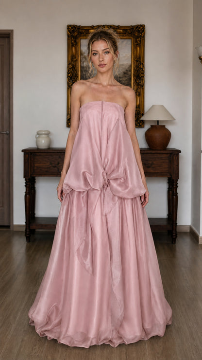 Model wearing pink strapless tiered maxi dress