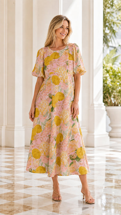 Model wearing pink citrus floral print midi dress