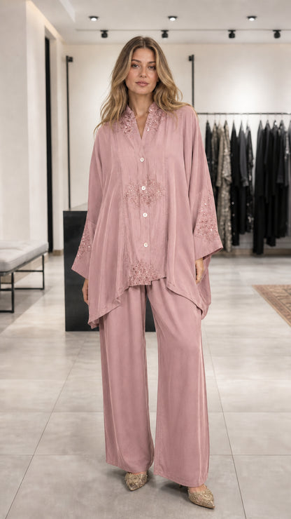 Model wearing pink embroidered lounge set