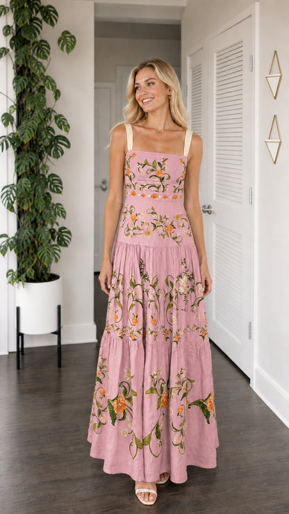 Front view of model wearing dusty pink floral embroidered tiered maxi dress