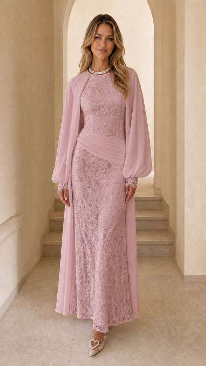 Front view of woman wearing pink long sleeve lace maxi dress