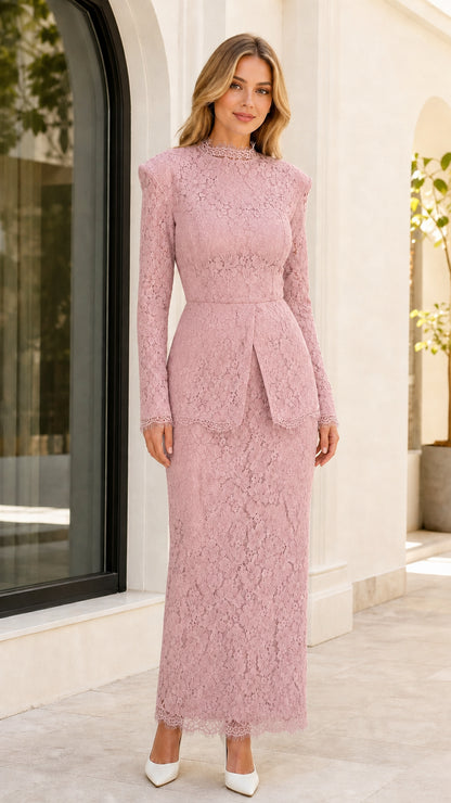 Front view of woman wearing dusty pink lace peplum maxi dress with long sleeves