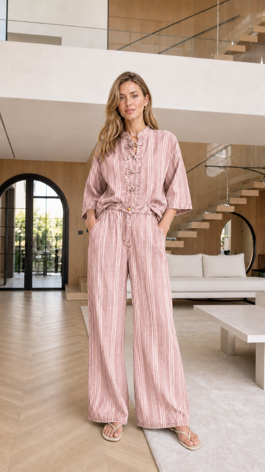Model wearing pink striped matching set