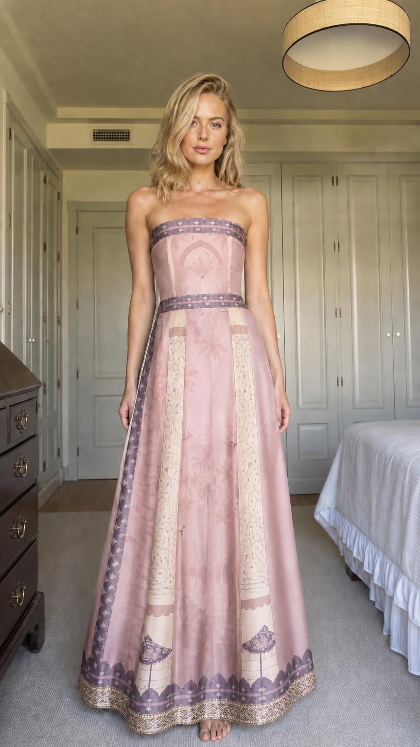 Front view of model wearing dusty pink strapless printed maxi dress