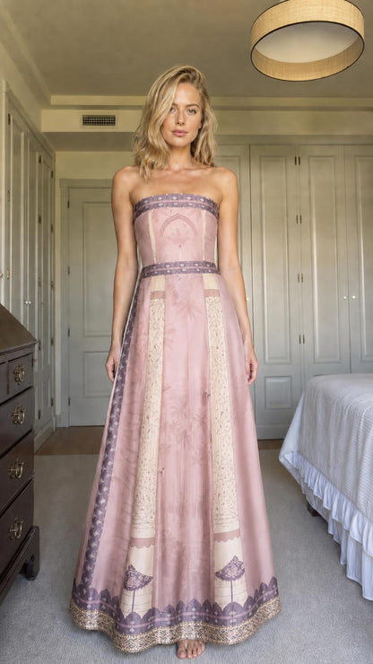 Front view of model wearing dusty pink strapless printed maxi dress